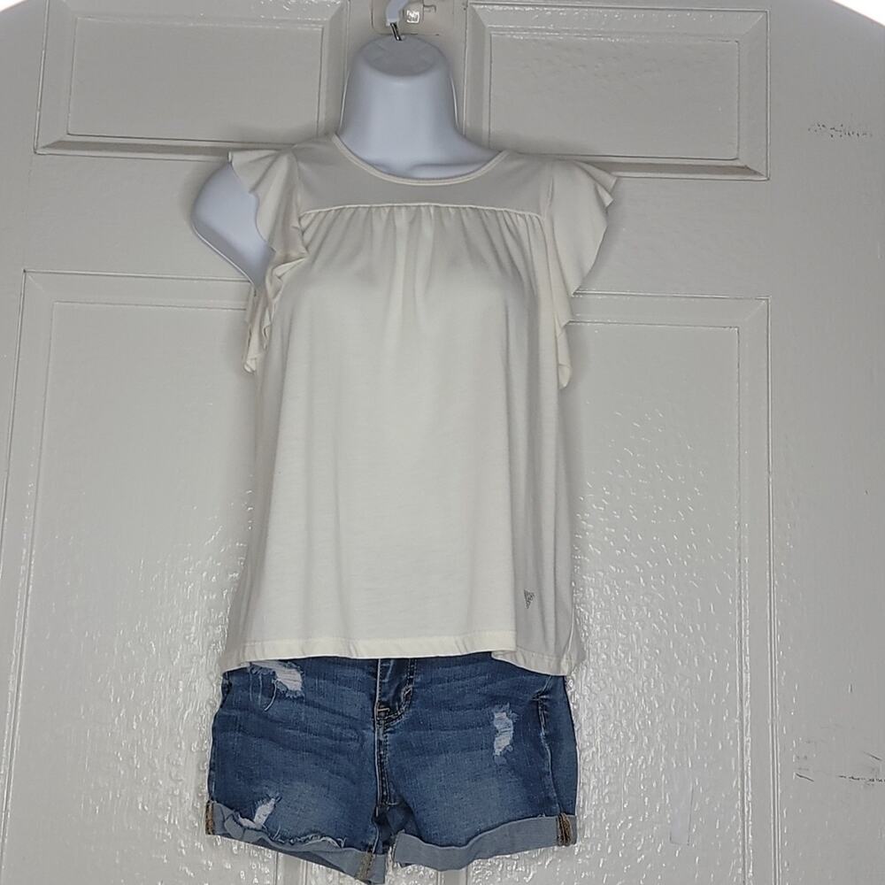 Girl's Guess brand, cream colored, sleeveless top. M 10/12 Ruffle at arm opening